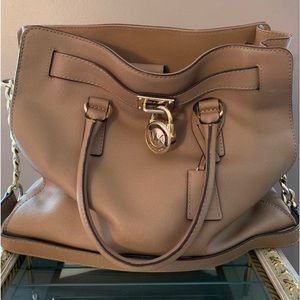 tan leather Michael Kors oversized bag.Wear on your arm or as a crossbody bag
